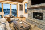 The living room features a stone gas fireplace to keep warm on chilly Montana days.